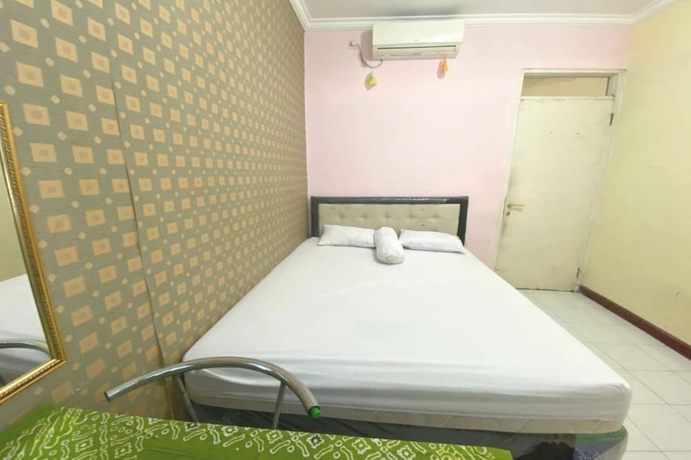 Imagen de la habitación del Hotel OYO 93641 Udayana Guesthouse Syariah. Foto 2