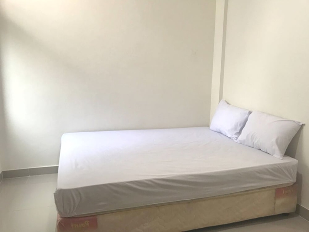 Imagen de la habitación del Hotel OYO 93641 Udayana Guesthouse Syariah. Foto 3
