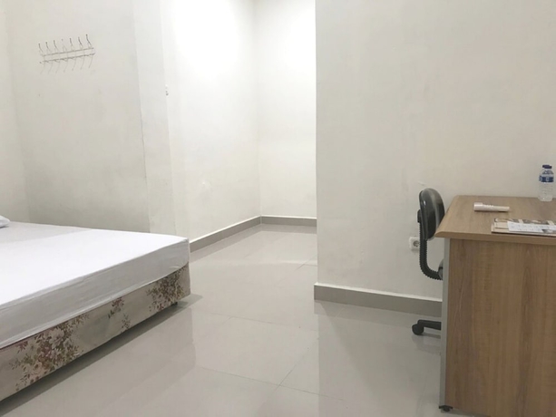 Imagen de la habitación del Hotel OYO 93641 Udayana Guesthouse Syariah. Foto 6