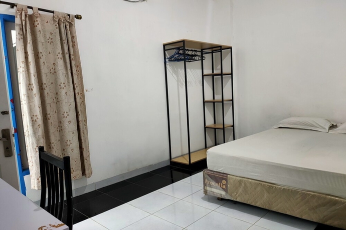 Imagen de la habitación del Hotel OYO 93650 Pondok Baruga 777. Foto 2