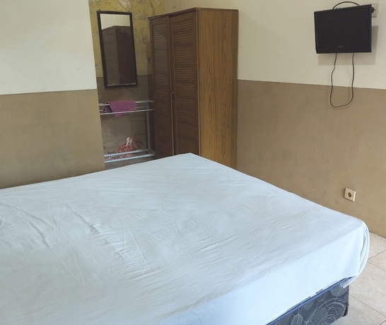 Imagen de la habitación del Hotel OYO 93657 Puri Batu Bolong. Foto 3