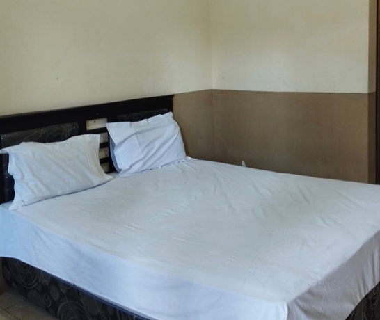 Imagen de la habitación del Hotel OYO 93657 Puri Batu Bolong. Foto 4