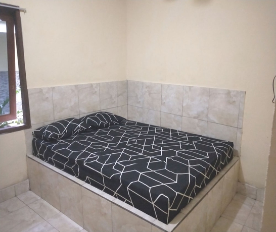 Imagen de la habitación del Hotel OYO 93666 Lestari Homestay. Foto 5