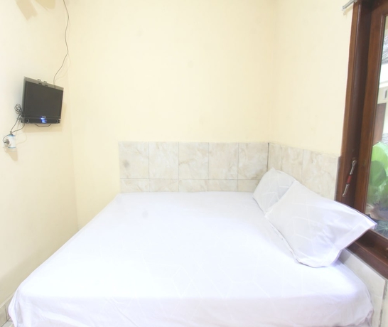Imagen de la habitación del Hotel OYO 93666 Lestari Homestay. Foto 6