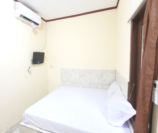Imagen de la habitación del Hotel OYO 93666 Lestari Homestay. Foto 11