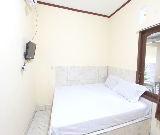 Imagen de la habitación del Hotel OYO 93666 Lestari Homestay. Foto 12