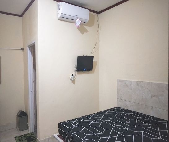 Imagen de la habitación del Hotel OYO 93666 Lestari Homestay. Foto 13