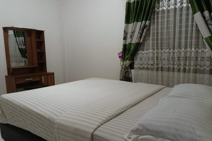 Imagen de la habitación del Hotel OYO 93706 Penginapan Syariah Hj. Kenan, Bungo Koto Tuo. Foto 5