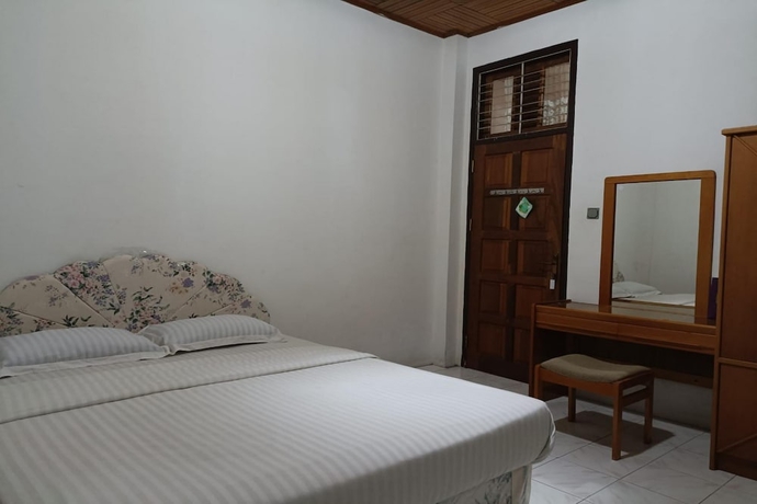 Imagen de la habitación del Hotel OYO 93706 Penginapan Syariah Hj. Kenan, Bungo Koto Tuo. Foto 6