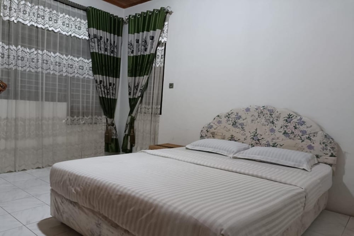 Imagen de la habitación del Hotel OYO 93706 Penginapan Syariah Hj. Kenan, Bungo Koto Tuo. Foto 7