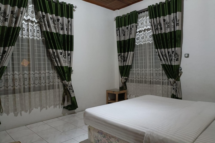 Imagen de la habitación del Hotel OYO 93706 Penginapan Syariah Hj. Kenan, Bungo Koto Tuo. Foto 8