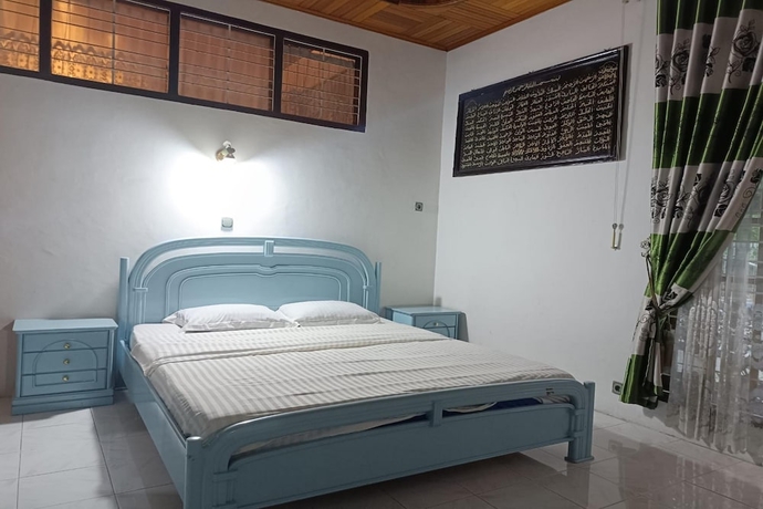 Imagen de la habitación del Hotel OYO 93706 Penginapan Syariah Hj. Kenan, Bungo Koto Tuo. Foto 17