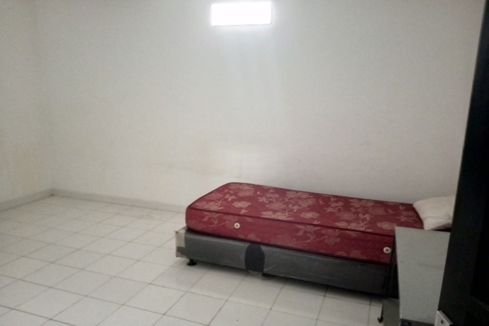 Imagen de la habitación del Hotel OYO 93722 Shannhay Guest House Syariah. Foto 11
