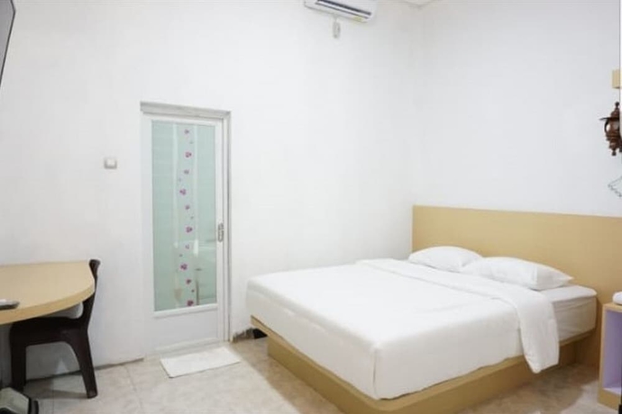 Imagen de la habitación del Hotel OYO 93745 Penginapan Naya Rita. Foto 2