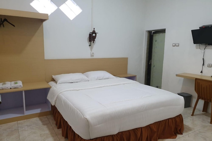 Imagen de la habitación del Hotel OYO 93745 Penginapan Naya Rita. Foto 7