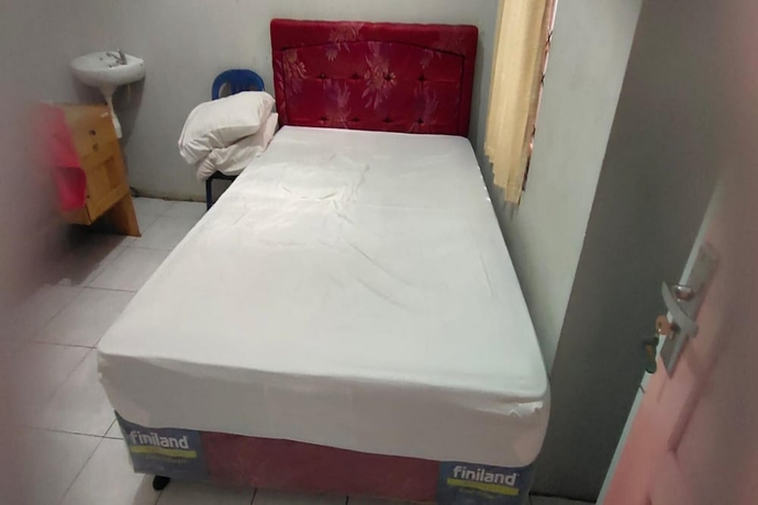 Imagen de la habitación del Hotel OYO 93745 Penginapan Naya Rita. Foto 8