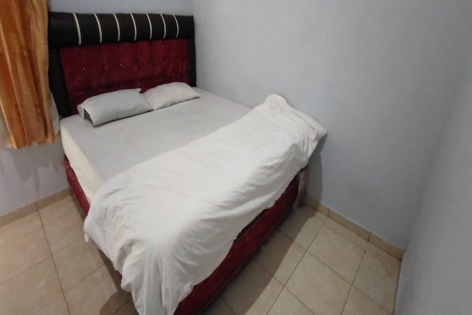 Imagen de la habitación del Hotel OYO 93745 Penginapan Naya Rita. Foto 9