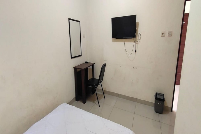 Imagen de la habitación del Hotel OYO 93745 Penginapan Naya Rita. Foto 10