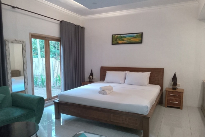 Imagen de la habitación del Hotel OYO 93748 Tungku Klui. Foto 2