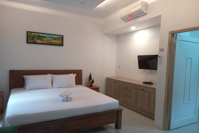 Imagen de la habitación del Hotel OYO 93748 Tungku Klui. Foto 9
