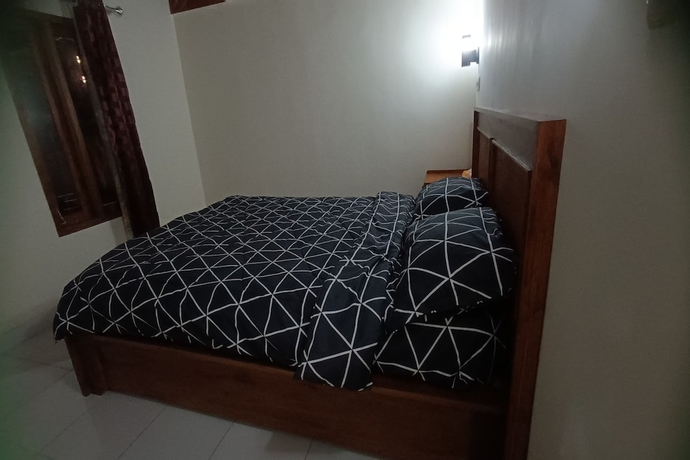 Imagen de la habitación del Hotel OYO 93766 Bunga Homestay. Foto 7
