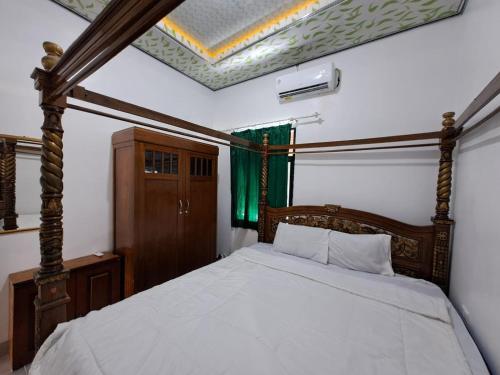 Imagen de la habitación del Hotel OYO 93814 Amanda Homestay. Foto 20