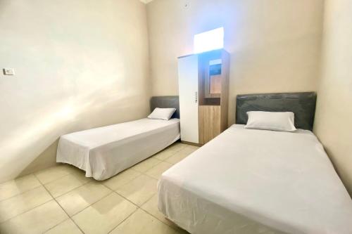 Imagen general del Hotel OYO 93838 Delia Inn Syariah. Foto 11