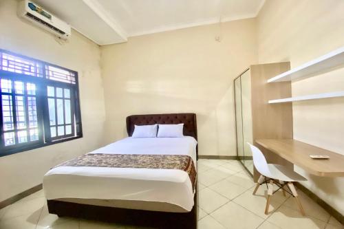 Imagen de la habitación del Hotel OYO 93838 Delia Inn Syariah. Foto 19