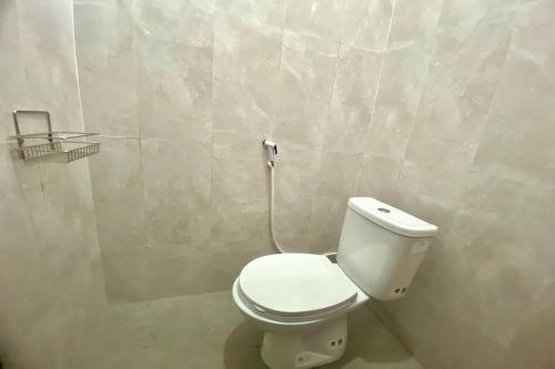 Imagen de la habitación del Hotel OYO 93838 Delia Inn Syariah. Foto 20