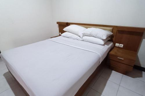 Imagen de la habitación del Hotel OYO 93885 D\'harjo Guesthouse. Foto 19