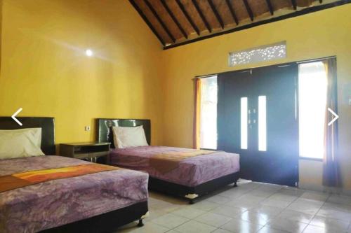 Imagen de la habitación del Hotel OYO 94014 The Sanya Homestay. Foto 20