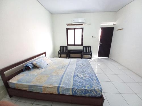 Imagen de la habitación del Hotel OYO 94034 Perbetulan Guest House Syariah. Foto 19