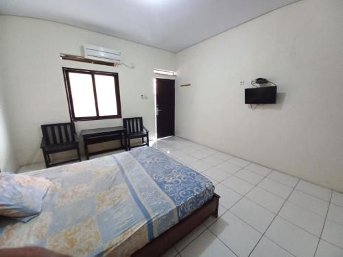 Imagen general del Hotel OYO 94034 Perbetulan Guest House Syariah. Foto 9