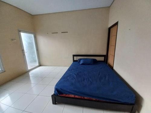Imagen de la habitación del Hotel OYO 94034 Perbetulan Guest House Syariah. Foto 20