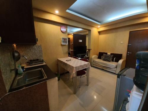 Imagen general del Hotel OYO 94052 Apartement Gateway Cicadas by Guling Property. Foto 11