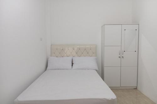 Imagen de la habitación del Hotel OYO 94066 Homestay Jaya Putri 1 Syariah. Foto 20