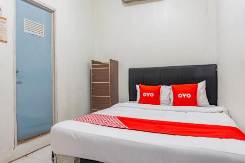 Imagen de la habitación del Hotel OYO 94067 The Roy Suite Guest House. Foto 20