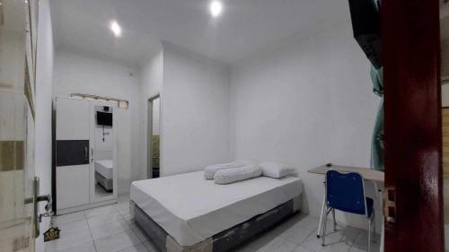 Imagen de la habitación del Hotel OYO 94075 Rafie Exclusive 2 Syariah. Foto 19