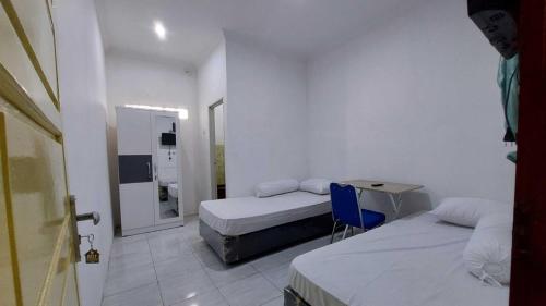 Imagen de la habitación del Hotel OYO 94075 Rafie Exclusive 2 Syariah. Foto 20