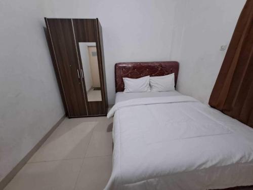 Imagen de la habitación del Hotel OYO 94090 Prasetya Homestay. Foto 20