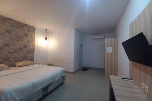 Imagen de la habitación del Hotel OYO 94103 Sandy Residence Ii. Foto 20