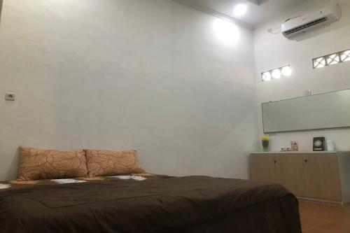 Imagen de la habitación del Hotel OYO 94153 Bantul Syariah Homestay. Foto 19
