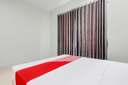 Imagen de la habitación del Hotel OYO 94210 D\'draman Homestay Syariah. Foto 19