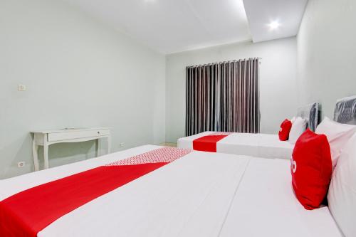 Imagen de la habitación del Hotel OYO 94210 D\'draman Homestay Syariah. Foto 20