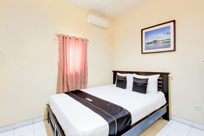 Imagen de la habitación del Hotel OYO 94761 Indah. Foto 3