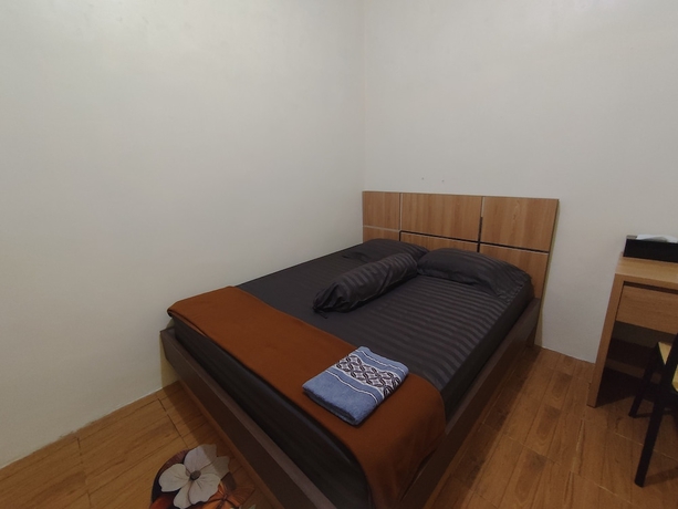 Imagen de la habitación del Hotel OYO 94933 Wisma Cha Tatami Palangkaraya. Foto 9