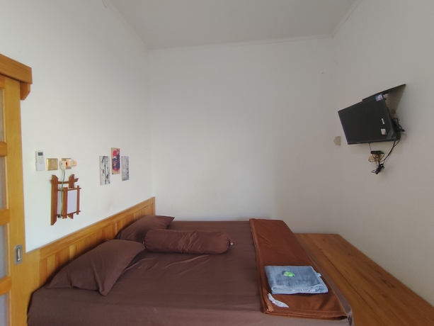 Imagen de la habitación del Hotel OYO 94933 Wisma Cha Tatami Palangkaraya. Foto 11