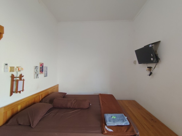 Imagen de la habitación del Hotel OYO 94933 Wisma Cha Tatami Palangkaraya. Foto 12