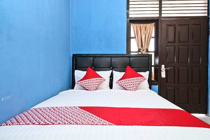 Imagen de la habitación del Hotel OYO 950 Steze Kost Syariah. Foto 11