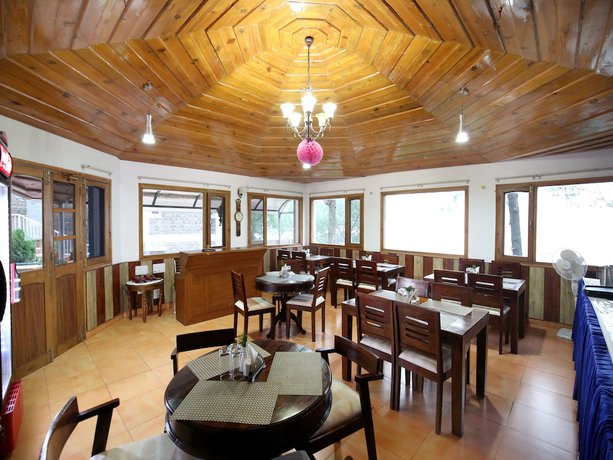 Imagen del bar/restaurante del Hotel OYO 9660 Blossom Resort. Foto 9